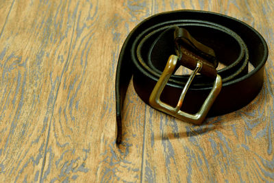 Close-up of belt on table