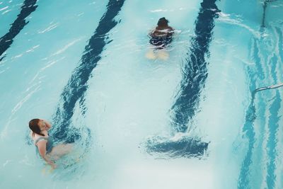 High angle view of woman swimming in pool