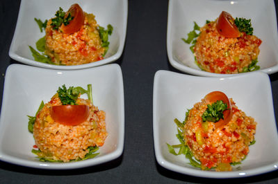 Close-up of couscous salad in plates on table for starters