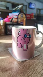 Close-up of coffee cup on table