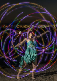 Full frame shot of illuminated light painting at night