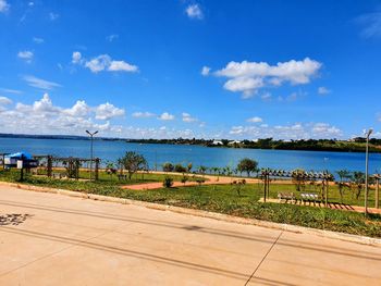 Scenic view of beach against blue sky