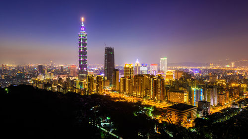 Illuminated buildings in city at night