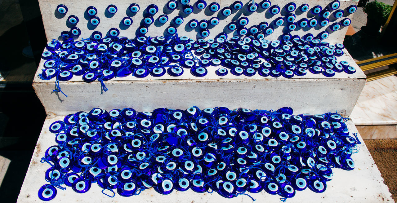HIGH ANGLE VIEW OF BLUE FOR SALE IN MARKET STALL