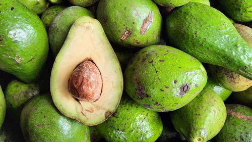 Full frame shot of green avocado for sale at market stall