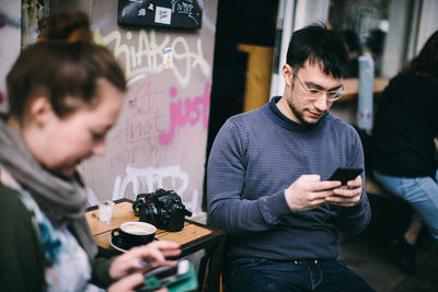 Young man using mobile phone