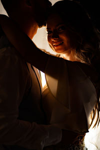 Portrait of bride embracing with groom