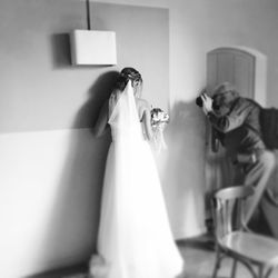 Midsection of couple standing in corridor