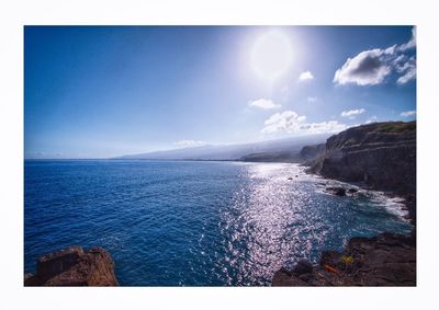 Scenic view of sea against blue sky