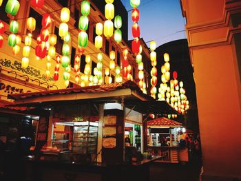 Illuminated lamps in city at night