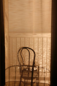 Shadow of person on hardwood floor at home