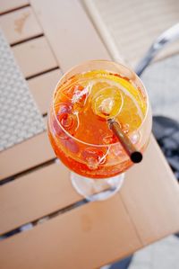 High angle view of cocktail glass on table at sidewalk cafe