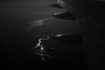 Cropped image of airplane flying over sea