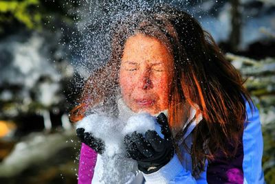 Woman playing with snow