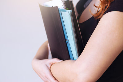 Close-up of woman hand holding book