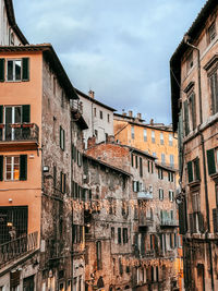Low angle view of buildings in city of perugia