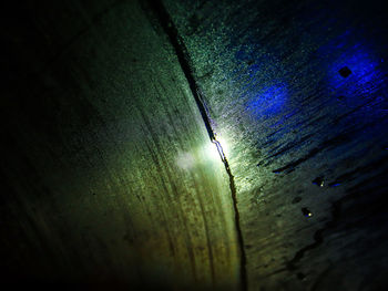 High angle view of raindrops on wet street