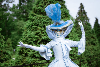 Woman in carnival dress mask