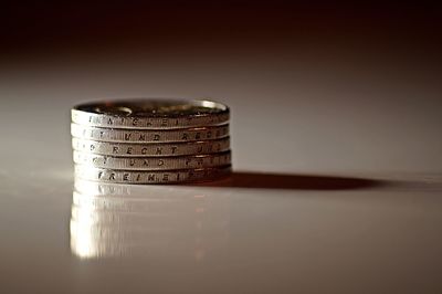 Stacked coins on white background