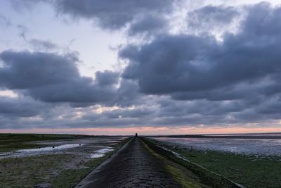 Scenic view of sea against storm clouds