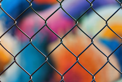 Full frame shot of chainlink fence against sky