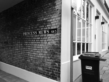 Close-up of text on brick wall