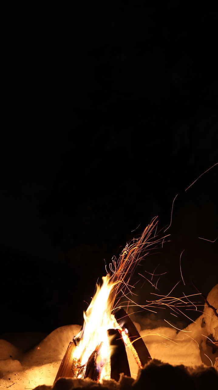 darkness, night, burning, light, heat, fire, copy space, motion, sparkler, flame, glowing, one person, nature, illuminated, campfire, blurred motion, long exposure, warning sign, lighting, dark, bonfire, event, orange color, sign, arts culture and entertainment