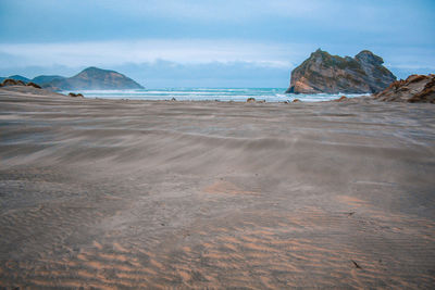 Scenic view of beach against sky