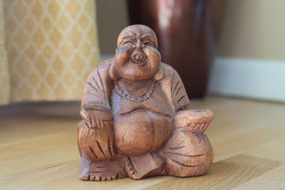 Close-up of statue on table at home