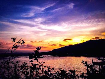 Scenic view of lake at sunset