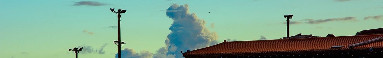 Low angle view of street light against sky