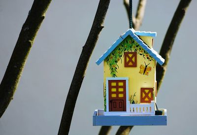 Birdhouse hanging on tree 