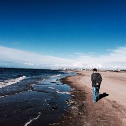 Woman standing on beach