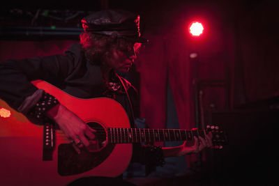 Guitarist performing at a nightclub