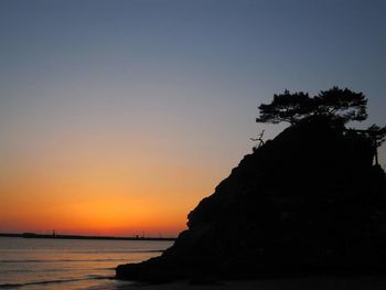 Scenic view of sea at sunset