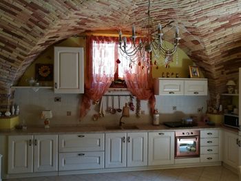 Chandelier in rustic kitchen