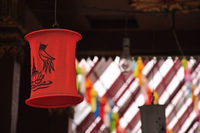 Low angle view of lantern hanging in building