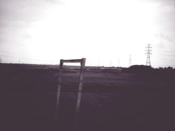 Low angle view of power lines against sky