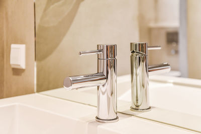 Close-up of faucet in bathroom