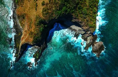 Close-up of water splashing on blue background