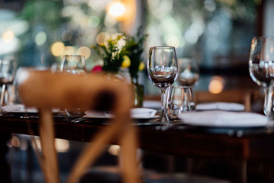  luxury table settings for fine dining with and glassware, pouring wine to glass. 