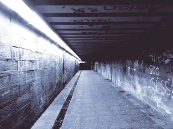 Empty road leading towards building