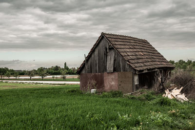 House on field against sky