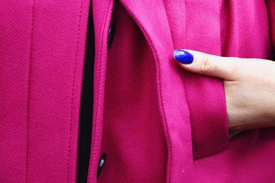 Woman hand with multi colored umbrella