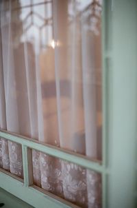 Close-up of glass window of house