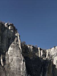 Scenic view of rocky mountains against clear sky