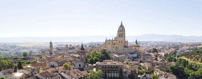 Panoramic view of buildings in city against clear sky