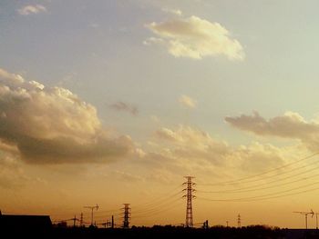 Low angle view of electricity pylon against sky