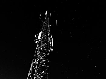 Low angle view of ferris wheel against sky at night