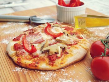 Close-up of pizza on chopping board